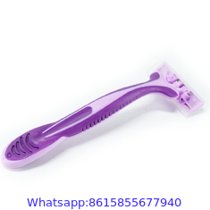 Triple stainless steel blade razor with lubricating strip