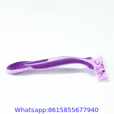 Triple stainless steel blade razor with lubricating strip