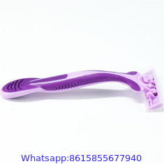 Triple stainless steel blade razor with lubricating strip