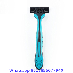 Triple stainless steel blade razor with lubricating strip