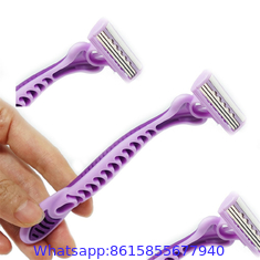 Pivot head triple blade razor with rubber handle